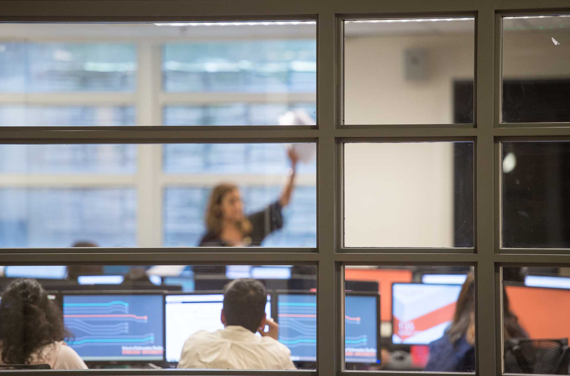 An iSchool class seen through a window