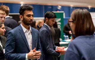 Students networking at the career fair