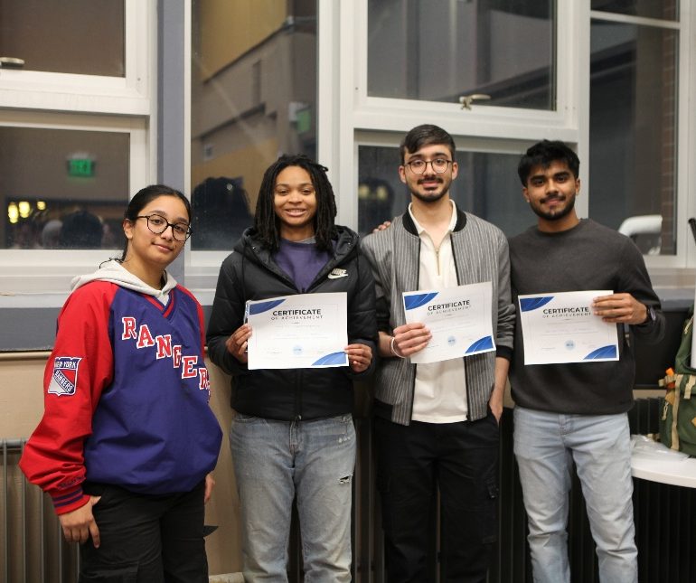 students holding up certificates